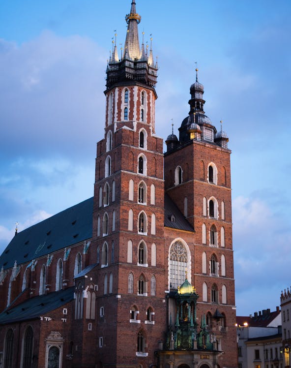 St. Mary's Basilica in Krakow with its iconic twin towers at dusk.