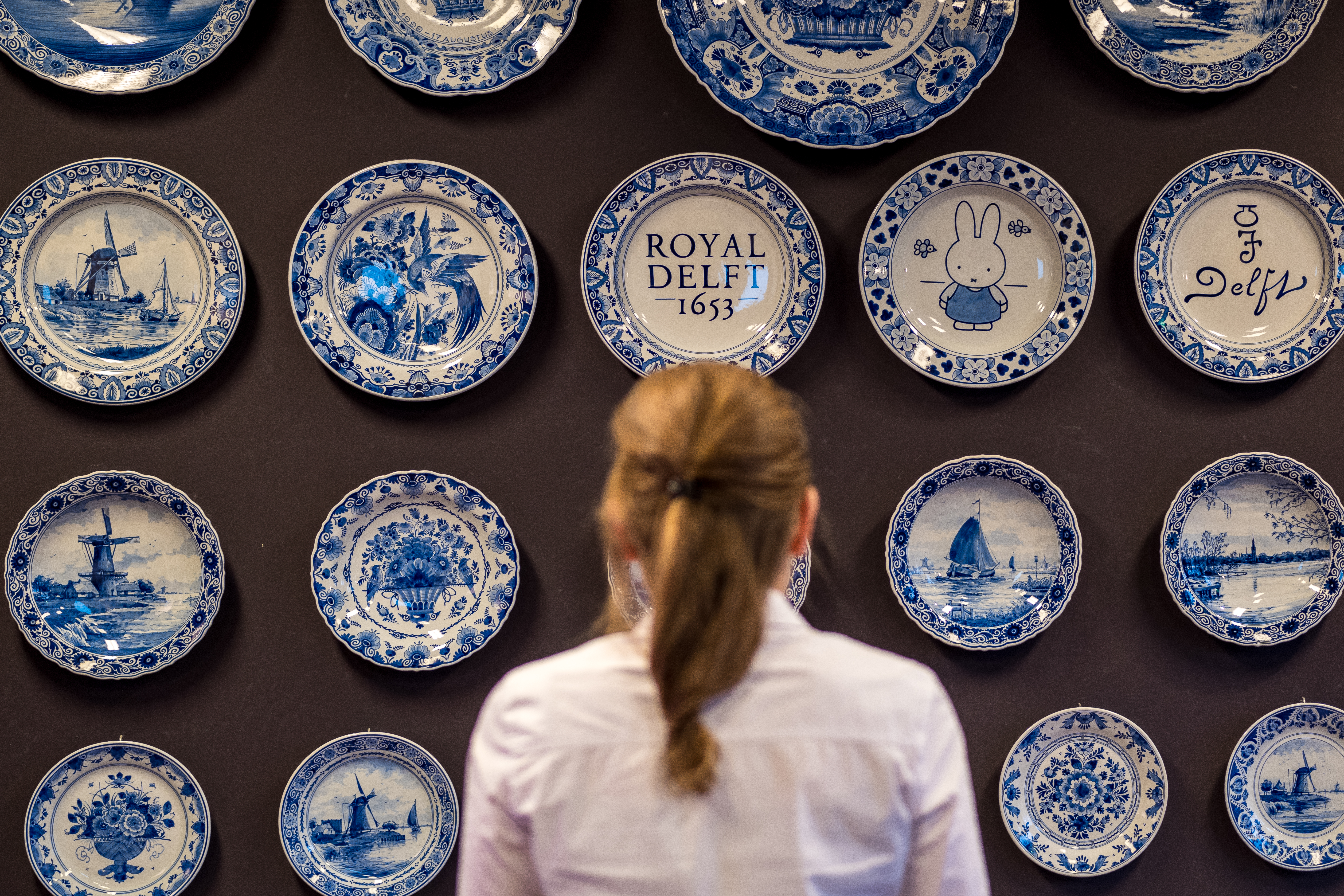 Royal Delft pottery display in Rotterdam museum.