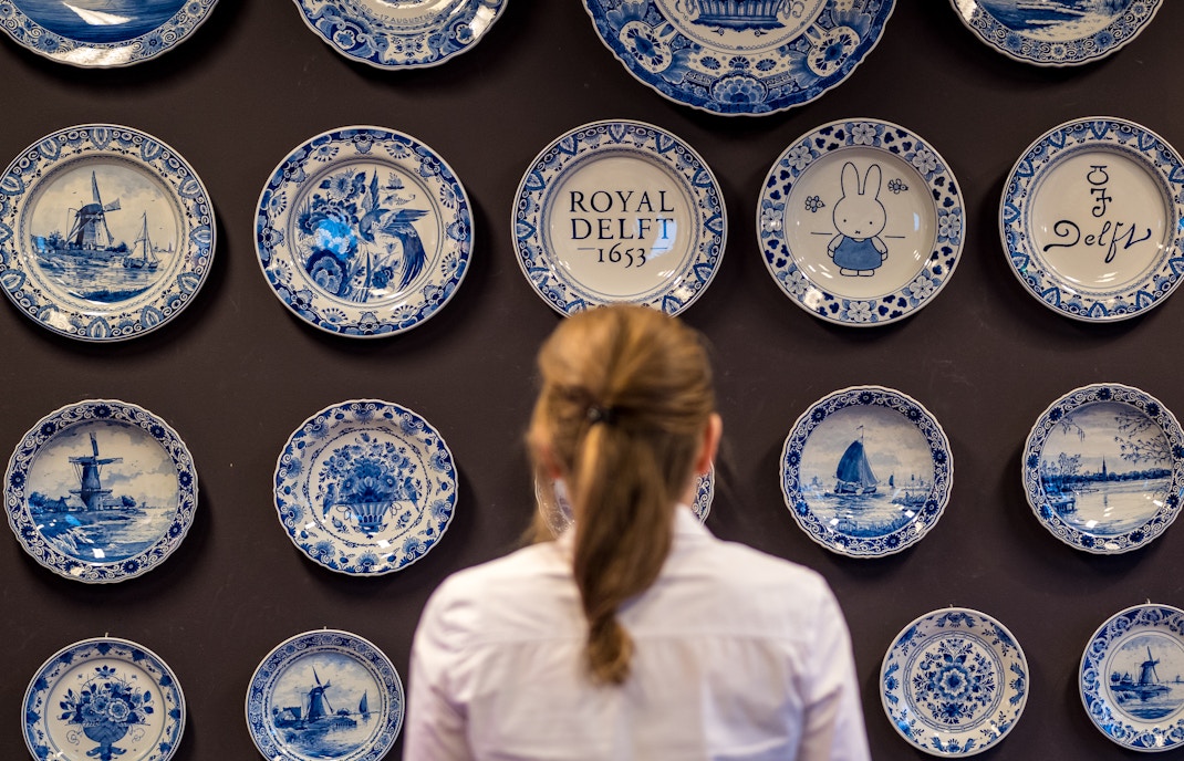 Royal Delft pottery display in Rotterdam museum.