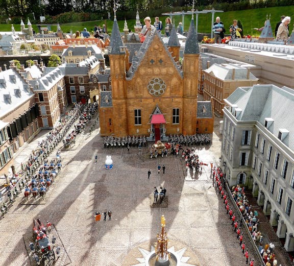 Miniature model of Binnenhof in The Hague with people observing the detailed architecture.