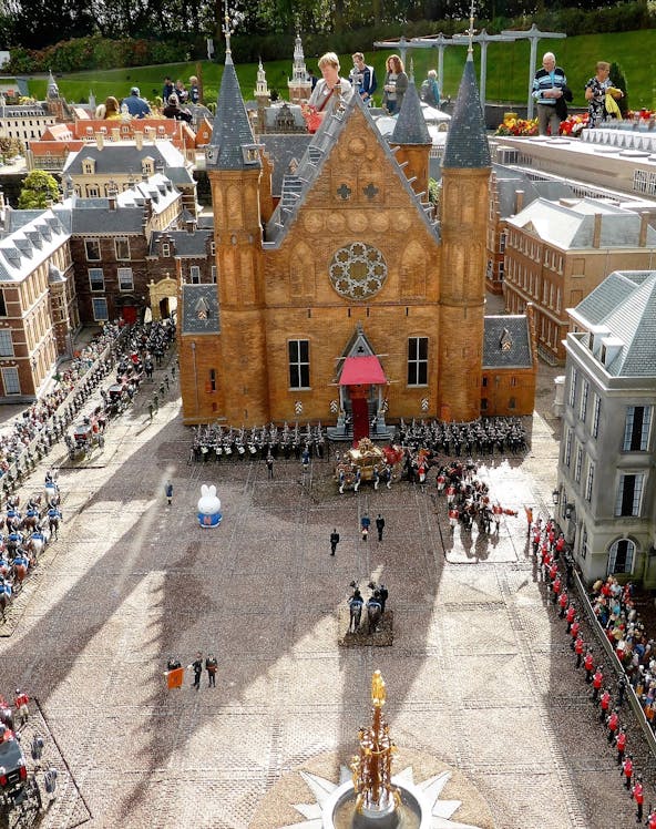 Miniature model of Binnenhof in The Hague with people observing the detailed architecture.