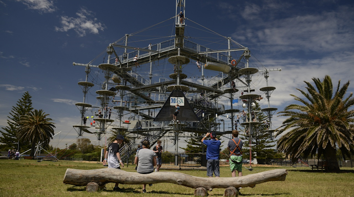 Adventure park ropes course with visitors in Adelaide, Australia.