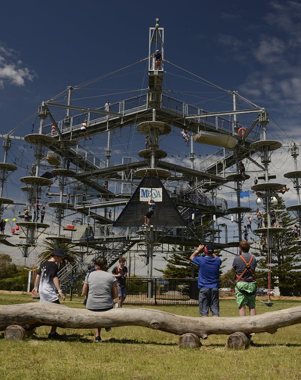 Adventure park ropes course with visitors in Adelaide, Australia.