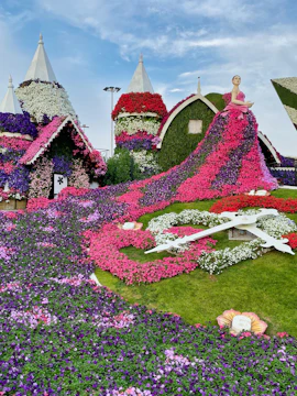 Dubai Miracle Garden floral clock and flower-covered houses.
