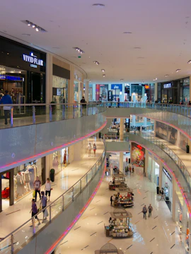 Dubai shopping mall interior with multiple floors and people walking.