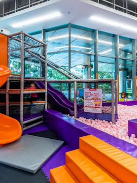 Indoor playground with slides and ball pit at Kiztopia Singapore.