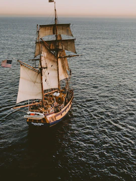 Sailing ship on the ocean at sunset, Fuerteventura La Aventura Pirata tour.