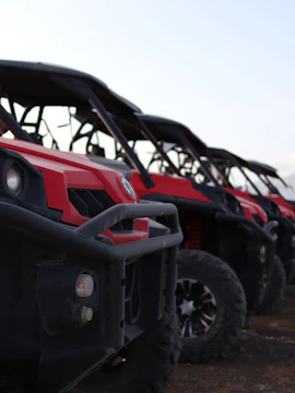 ATVs lined up for a land tour in Fuerteventura, showcasing rugged terrain exploration.