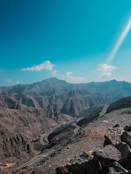 Winding road through rocky mountains in Ras Al Khaimah, UAE.
