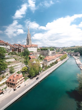 Aerial view of Bern with the Aare River and Bern Cathedral, part of Zurich to Bern tours.