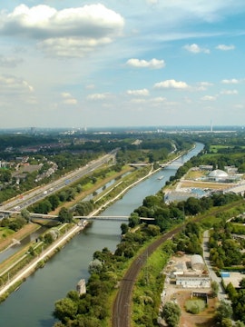 Aerial view of Oberhausen with river, roads, and green landscape near LEGOLAND Discovery Centre.