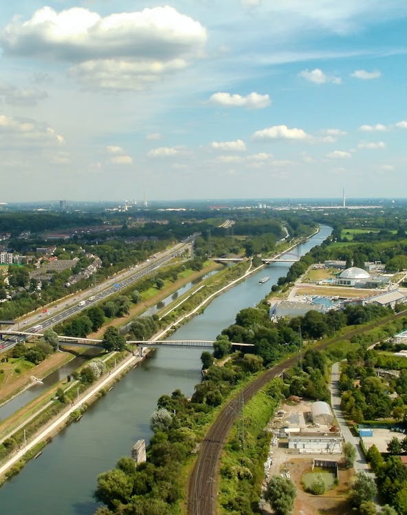 Aerial view of Oberhausen with river, roads, and green landscape near LEGOLAND Discovery Centre.