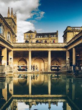 Ancient Roman Baths with columns and statues, reflecting in the water, Baths of Diocletian.