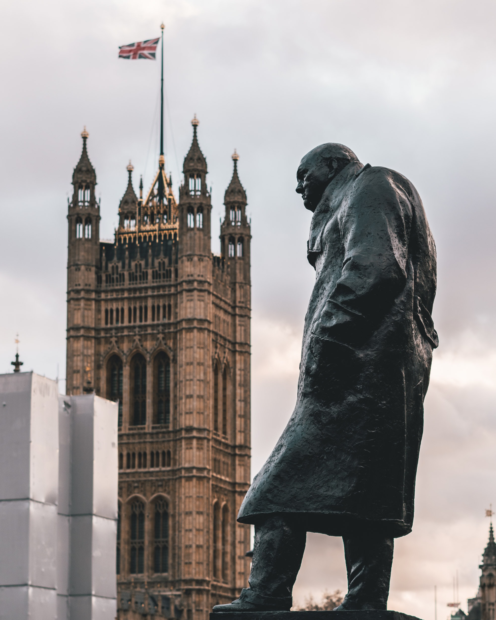 Statue of Winston Churchill with Westminster Palace in London.