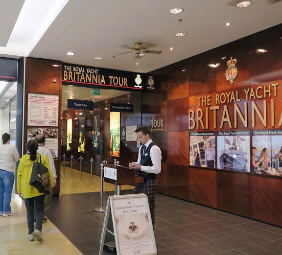 Visitors entering The Royal Yacht Britannia tour entrance in Edinburgh.