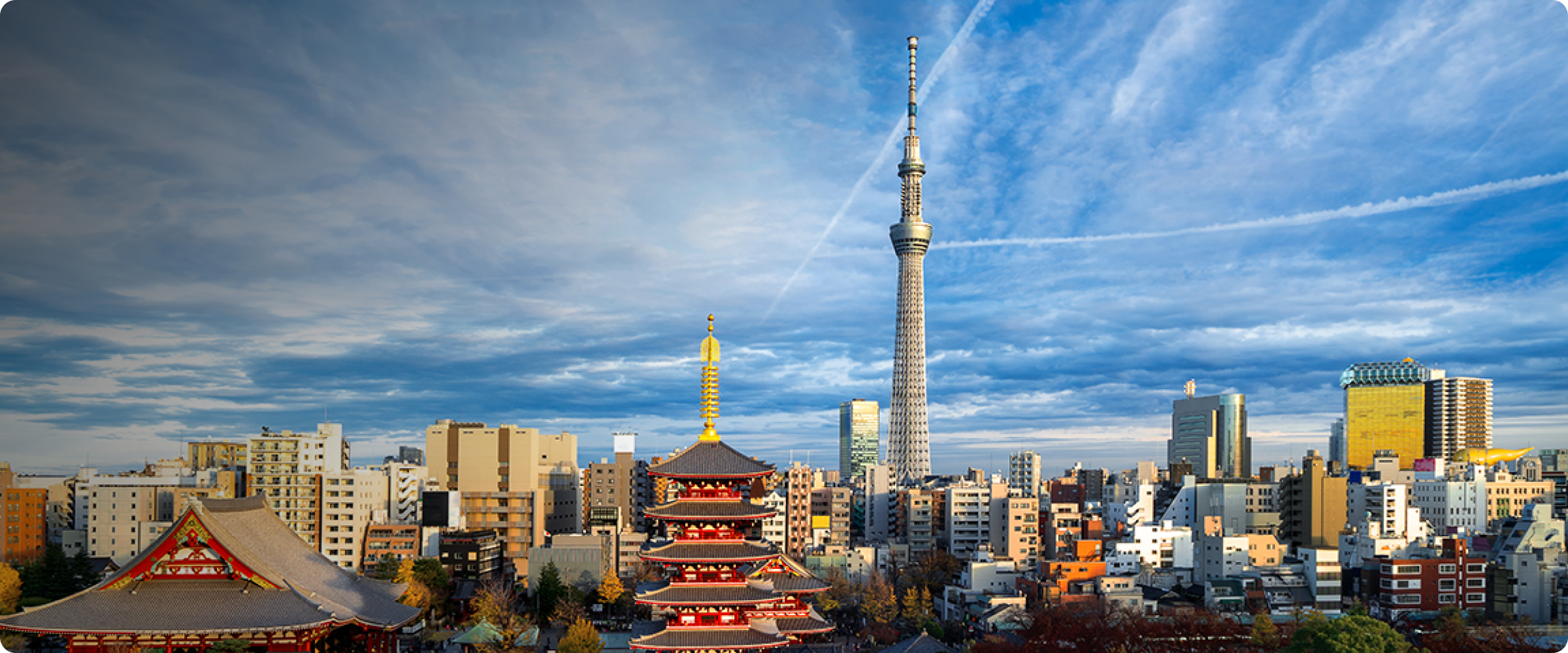 Tokyo skyline with Tokyo Skytree and Senso-ji Temple in the foreground.