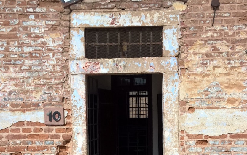 Entrance to Block A at Terezin Concentration Camp, showing weathered brick walls and open doorway.