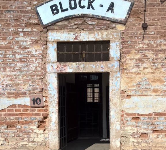 Entrance to Block A at Terezin Concentration Camp, showing weathered brick walls and open doorway.
