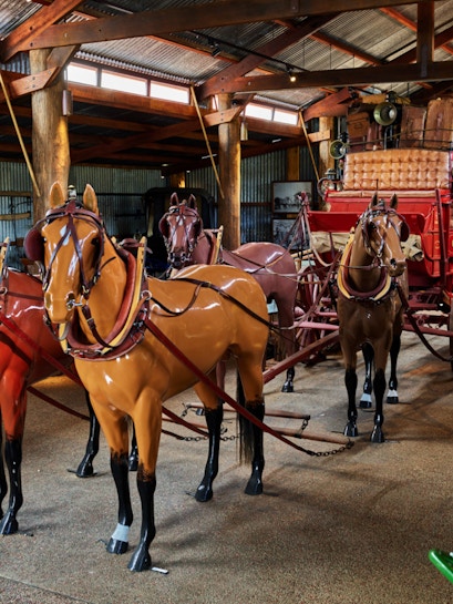 Horse-drawn carriage display in Heberton museum.