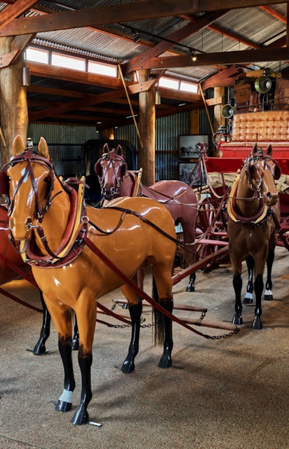 Horse-drawn carriage display in Heberton museum.
