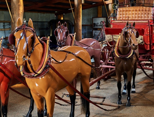 Horse-drawn carriage display in Heberton museum.
