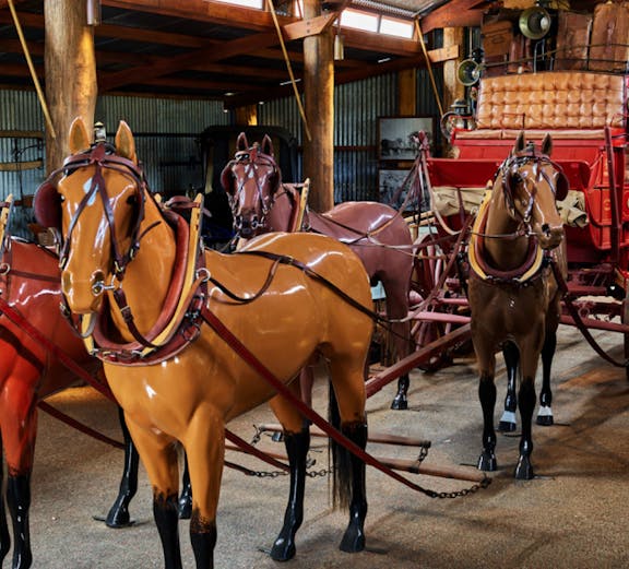 Horse-drawn carriage display in Heberton museum.