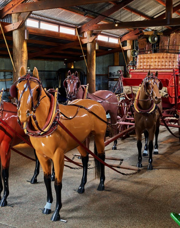 Horse-drawn carriage display in Heberton museum.