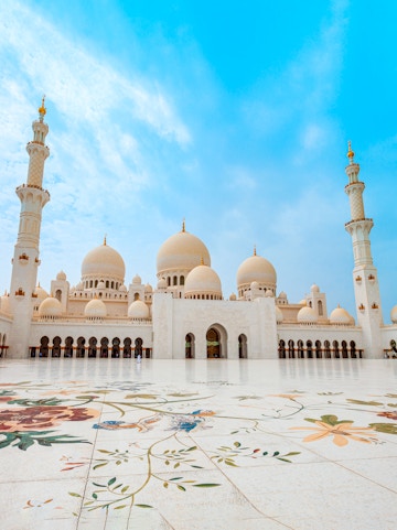Sheikh Zayed Grand Mosque in Abu Dhabi with floral courtyard design.