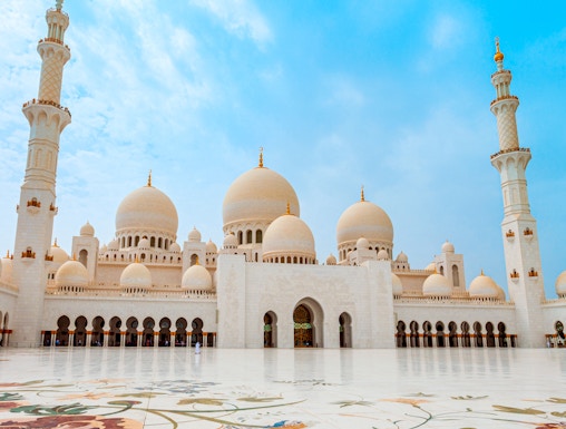 Sheikh Zayed Grand Mosque in Abu Dhabi with floral courtyard design.