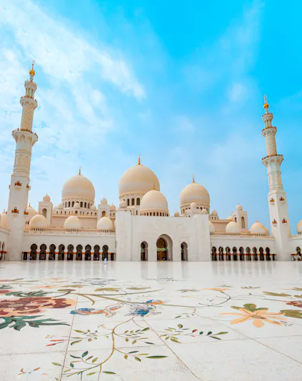 Sheikh Zayed Grand Mosque in Abu Dhabi with floral courtyard design.