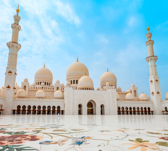 Sheikh Zayed Grand Mosque in Abu Dhabi with floral courtyard design.