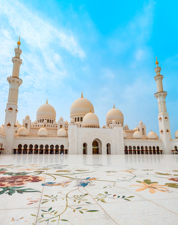 Sheikh Zayed Grand Mosque in Abu Dhabi with floral courtyard design.