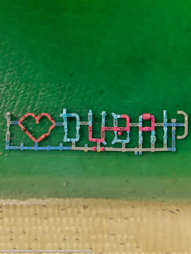 Floating water park spelling "Dubai" in the sea at Aqua Fun Dubai.