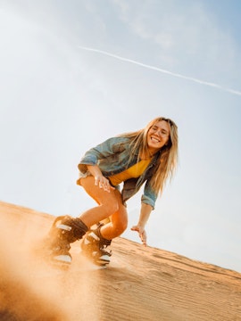 Sandboarding adventure at Desert Conservation Reserve.