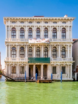 Ca' Rezzonico museum facade along the Grand Canal in Venice, Italy.