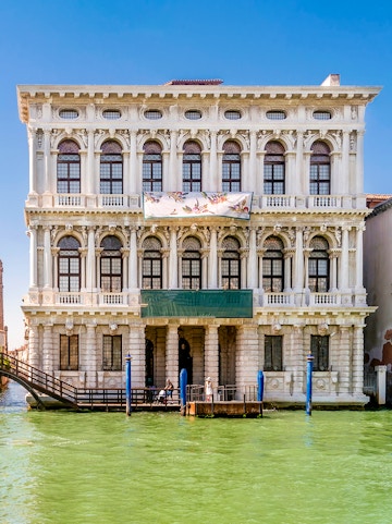Ca' Rezzonico museum facade along the Grand Canal in Venice, Italy.