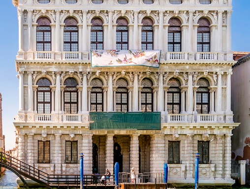 Ca' Rezzonico museum facade along the Grand Canal in Venice, Italy.