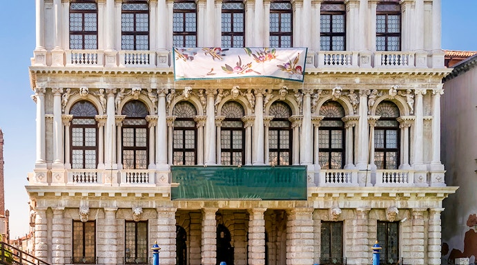 Ca' Rezzonico museum facade along the Grand Canal in Venice, Italy.