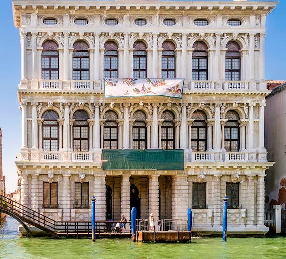 Ca' Rezzonico museum facade along the Grand Canal in Venice, Italy.