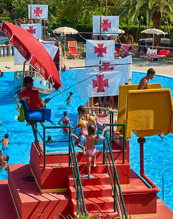 Children playing on a pirate ship water slide at Caravelle Aquapark.