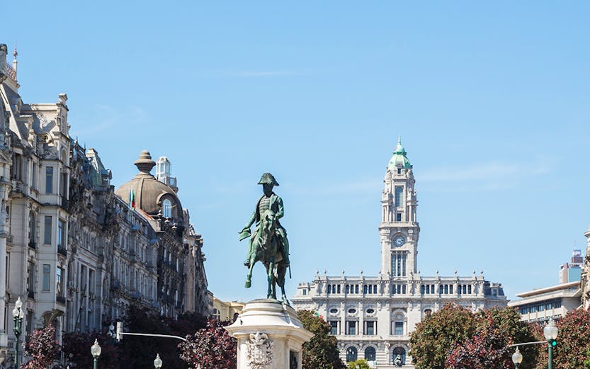 Avenida dos Aliados in Porto with equestrian statue and city hall in the background.