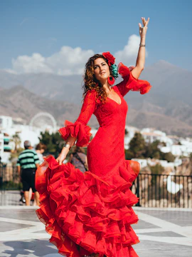 Flamenco dancer in red dress performing in Madrid.