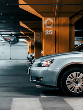 Underground parking garage in Venice with parked cars.