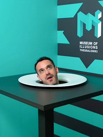 Head illusion exhibit at Museum of Illusions Athens.