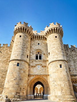 Palace of the Grand Master entrance, Rhodes, with medieval stone towers and archway.
