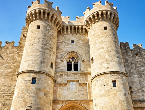 Palace of the Grand Master entrance, Rhodes, with medieval stone towers and archway.