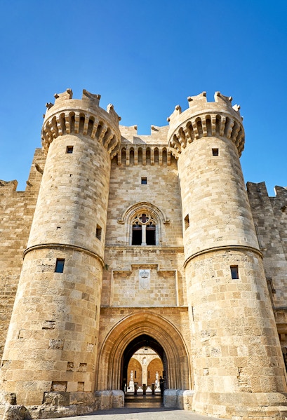 Palace of the Grand Master entrance, Rhodes, with medieval stone towers and archway.