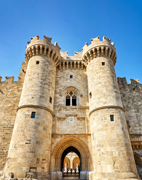 Palace of the Grand Master entrance, Rhodes, with medieval stone towers and archway.