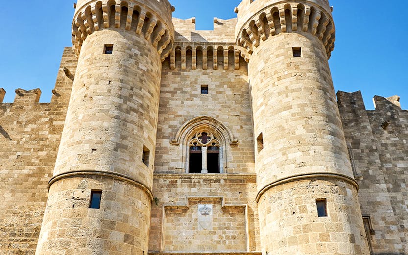 Palace of the Grand Master entrance, Rhodes, with medieval stone towers and archway.