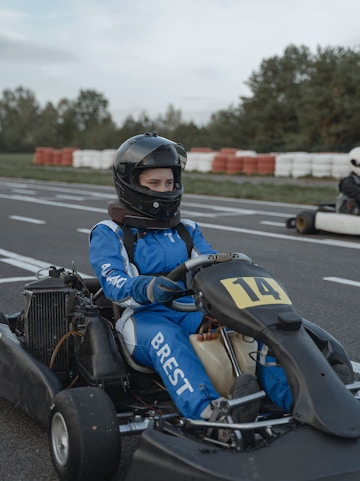 Go-kart racer in blue suit at Morac Adventure Park, Langkawi track.
